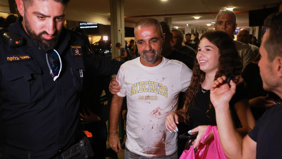 Israeli passenger Yaniv Hayoun, with blood stains on his shirt, who was aboard a Flydubai...
