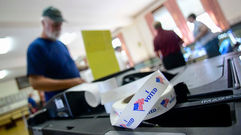 Sean Reid of Rockingham, Vt., casts his ballot at the polling station in Rockingham during...