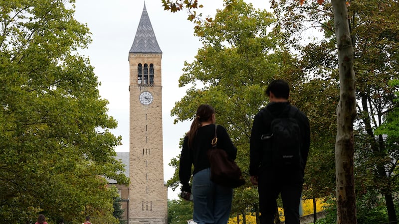 Pedestrians walk on the campus at Cornell University in Ithaca, N.Y., Thursday, Oct. 1, 2026....