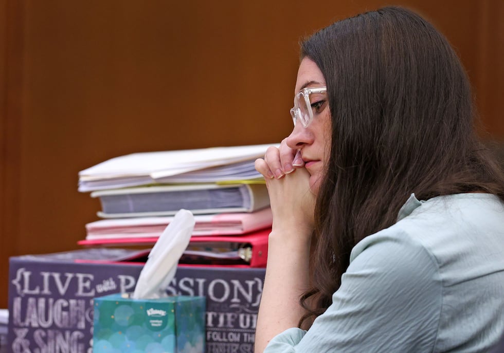 Lindsay Clancy listens to her mother Paula Musgrove on the witness stand during her murder...