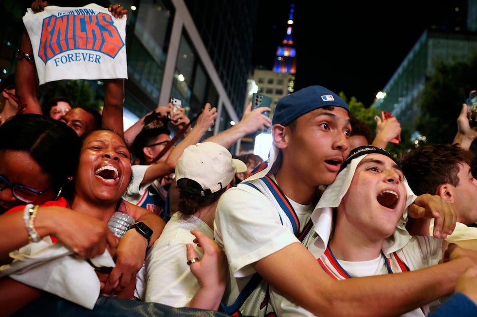 New York Knicks fans celebrate after winning Game 5 of the NBA Finals basketball series...
