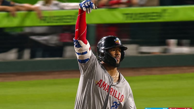 Sod Poodles' Manuel Pena trots the bases after hitting his 26th homerun of the season