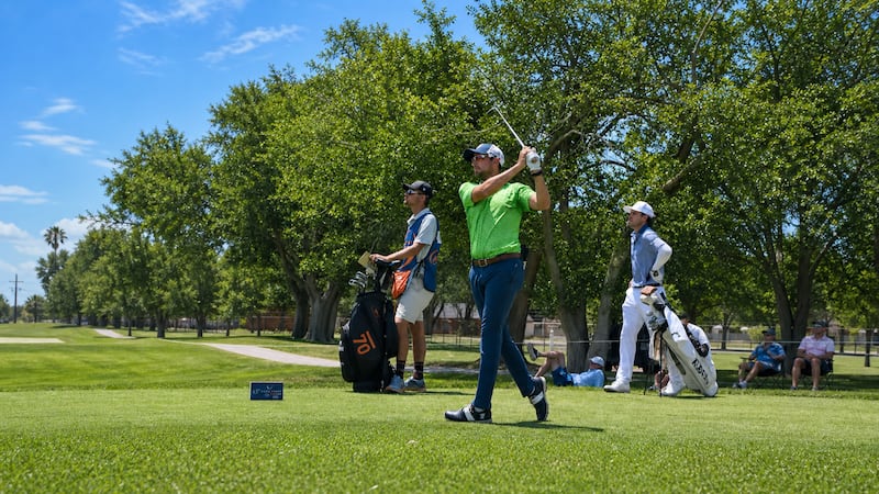 Fischer follows through on his tee shot after Day 3 of the OccuNet Classic.