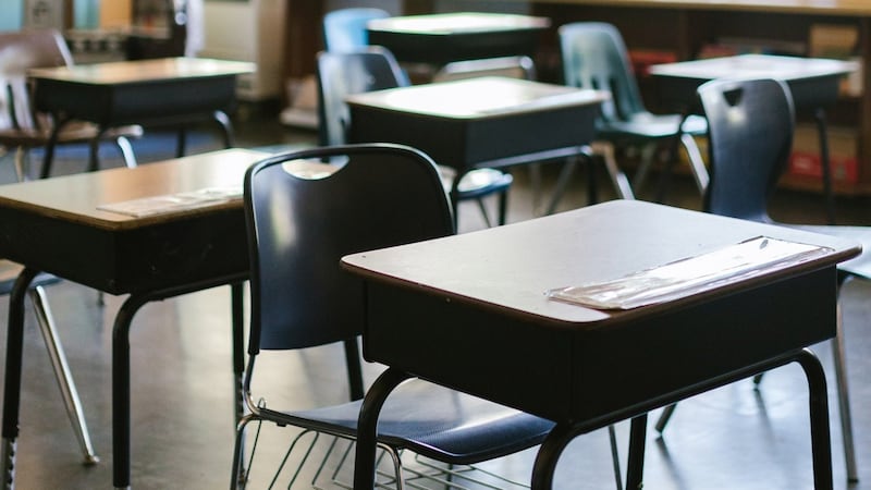 An Iowa high school teacher has been fired for offering students extra credit in return for...